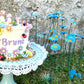 napperon-blanc-gâteau-anniversaire-trolls-fleurs-plat bleu